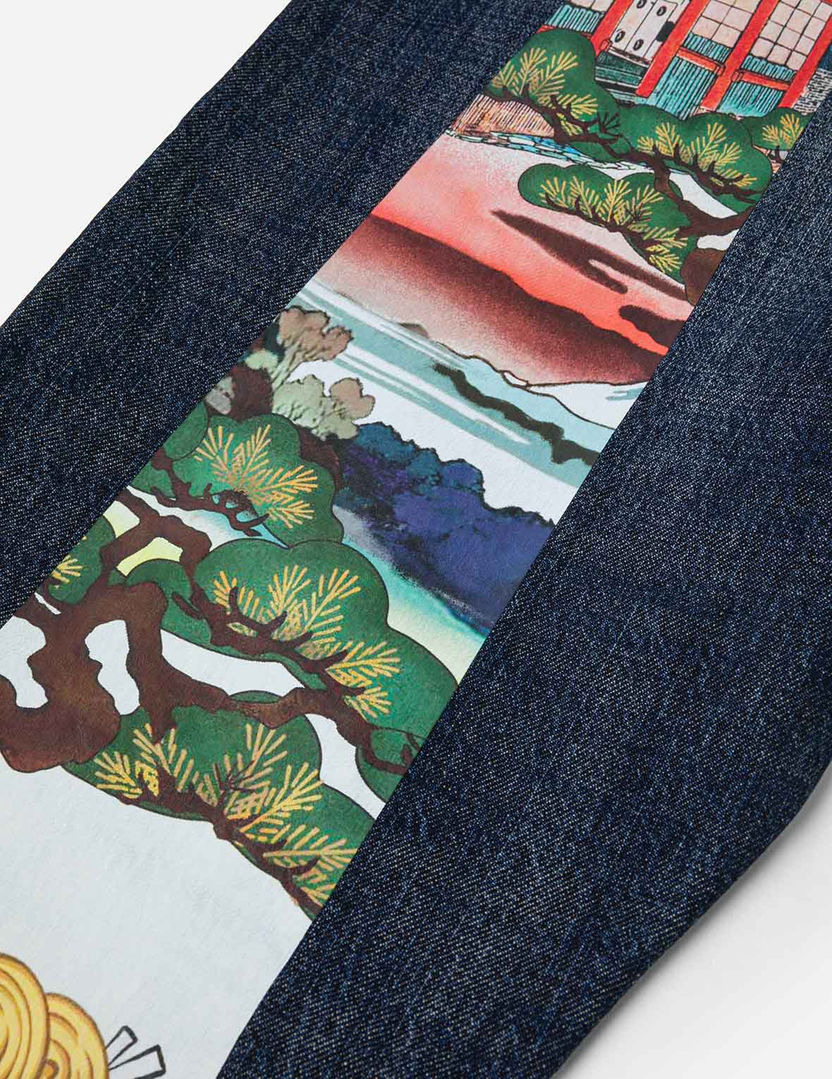 仏頭獅子舞大黒プリント テーパーフィット ジーンズ