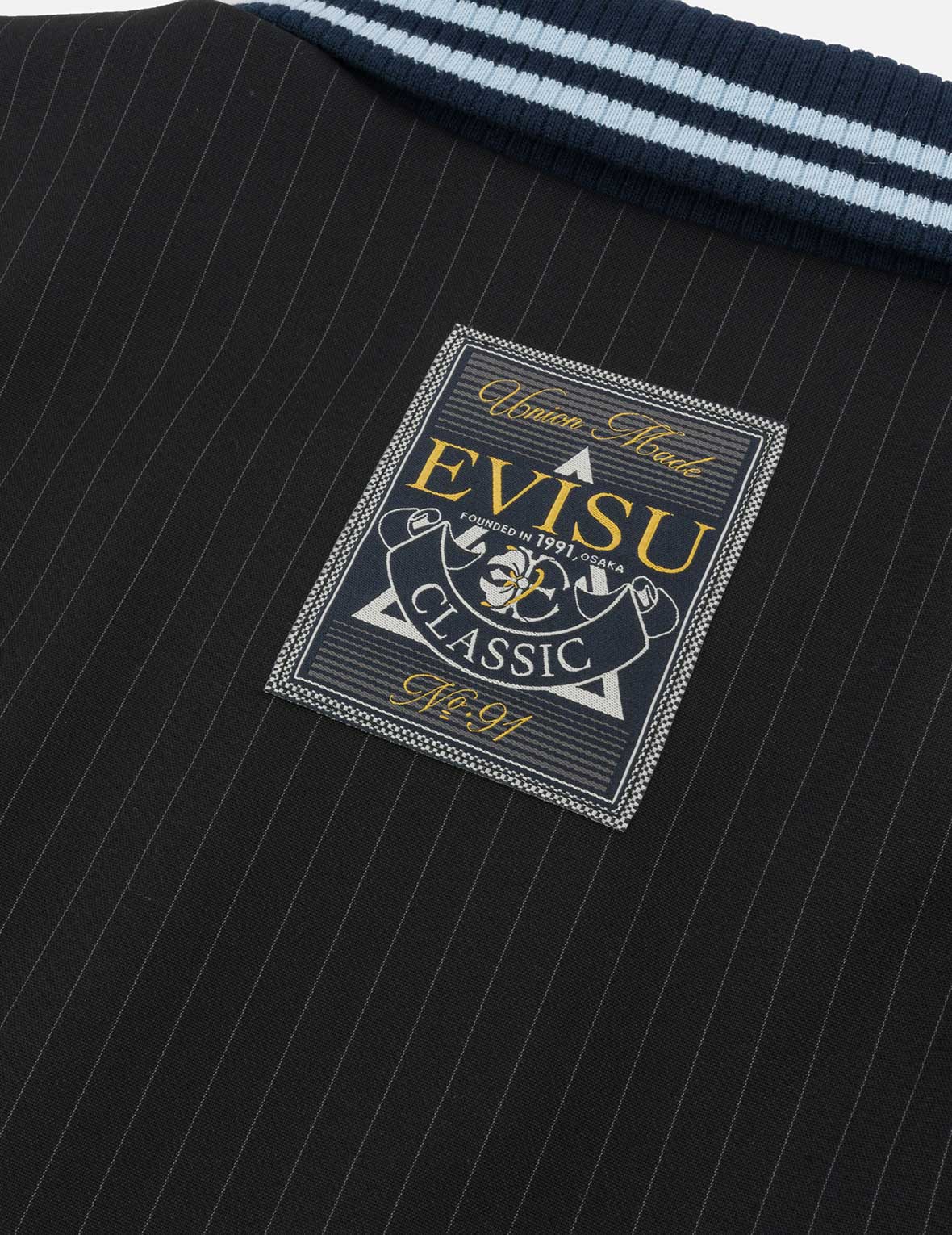 ロゴとスローガン刺繍 レギュラーフィットストライプスーツコーチジャケット