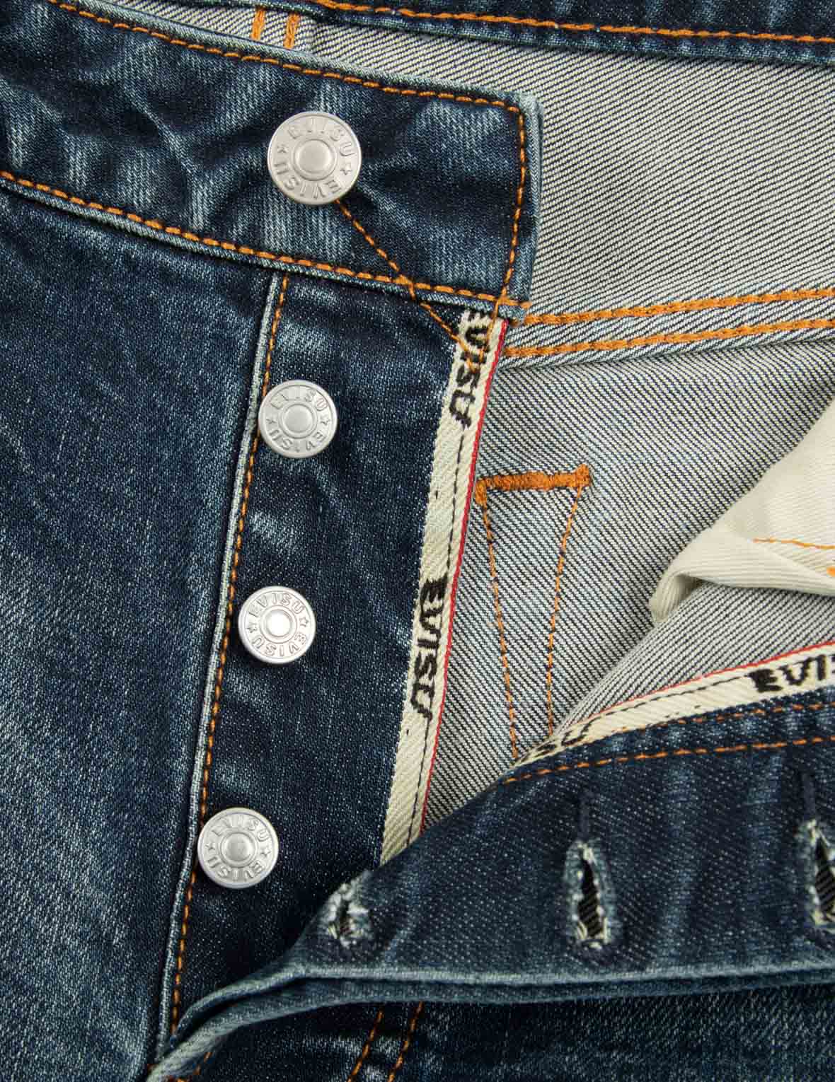 ウォッシュ加工のロゴと仏頭スロットコーティングリラックスフィットジーンズ