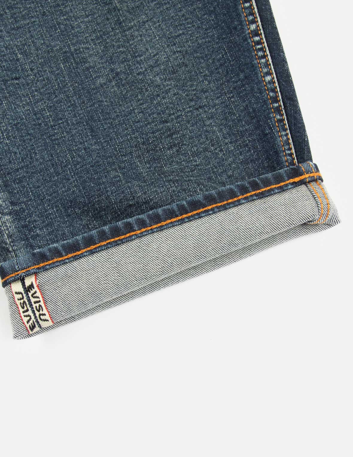 ウォッシュ加工のロゴと仏頭スロットコーティングリラックスフィットジーンズ