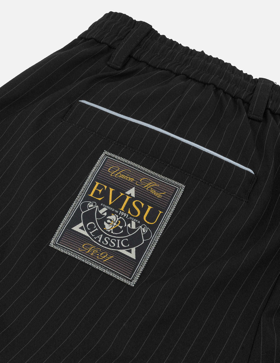 カモメ刺繍ストライプテーパーフィットウーブンパンツ – EVISU