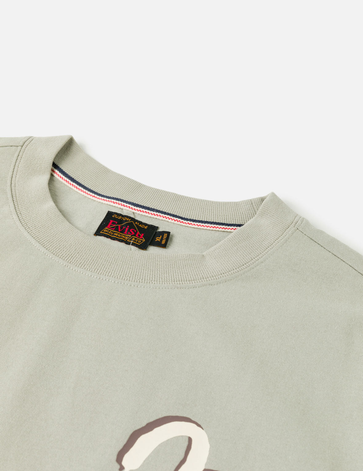 グラフィティロゴと仏頭プリントTシャツ